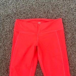 Bright neon orange leggings
